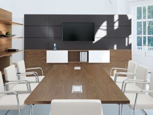 The conference table has a wooden color finish